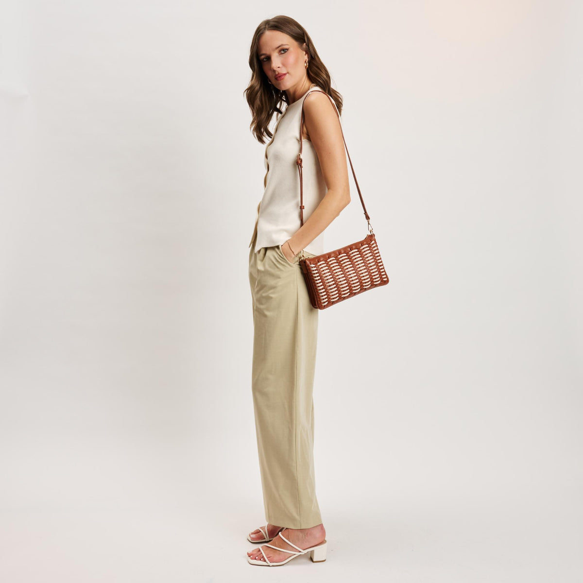Woman wearing Tan Ivory Moda Luxe Maggie Crossbody 842017141280 View 4 | Tan Ivory