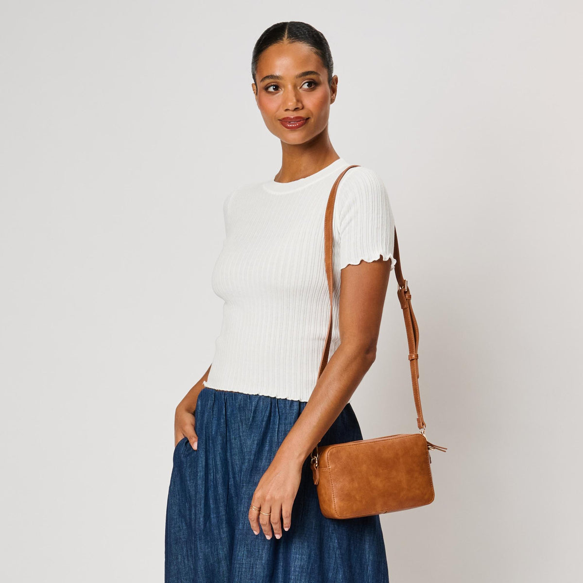 Woman wearing Tan Moda Luxe Skylie Crossbody 842017126706 View 3 | Tan