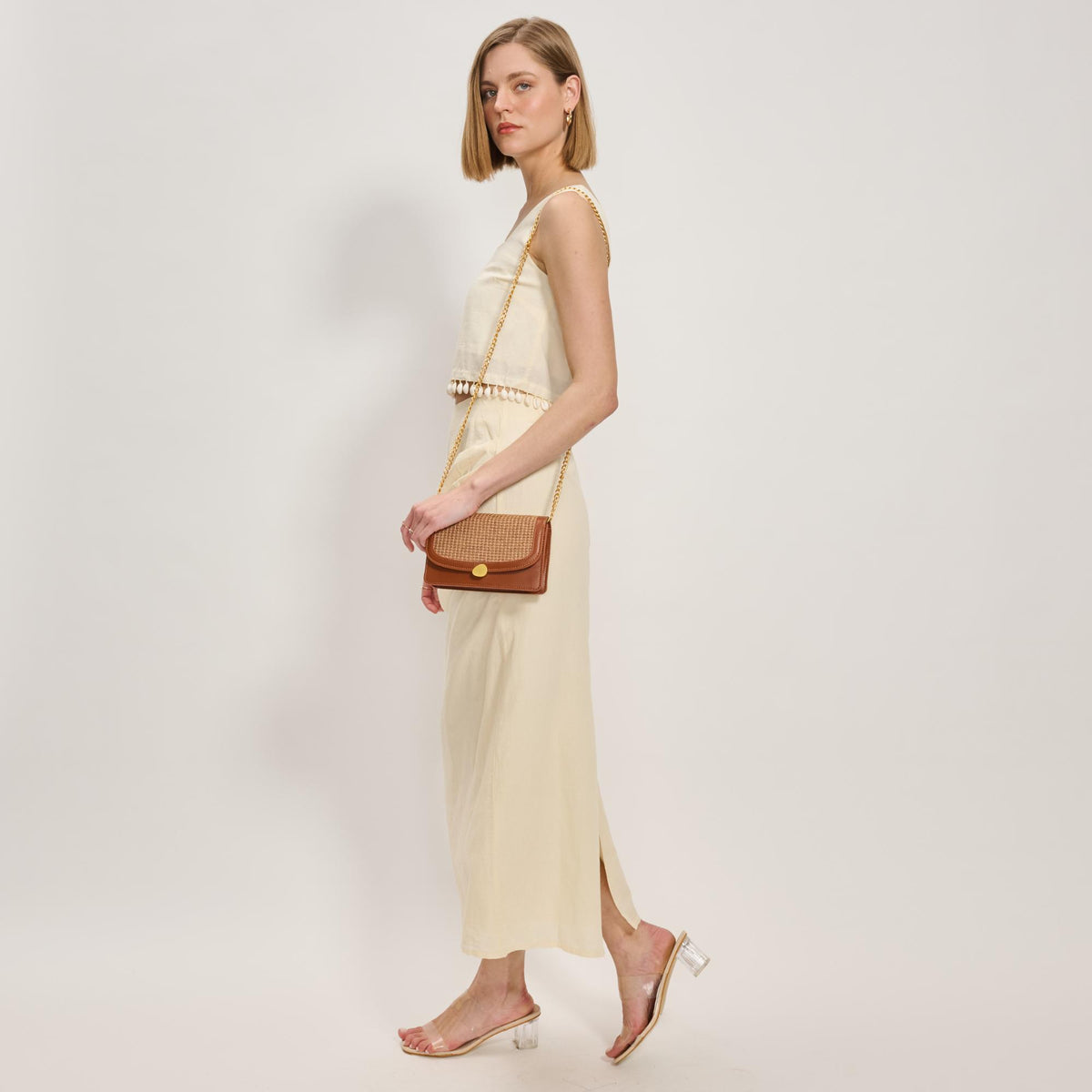 Woman wearing Tan Moda Luxe Nina Crossbody 842017137160 View 2 | Tan