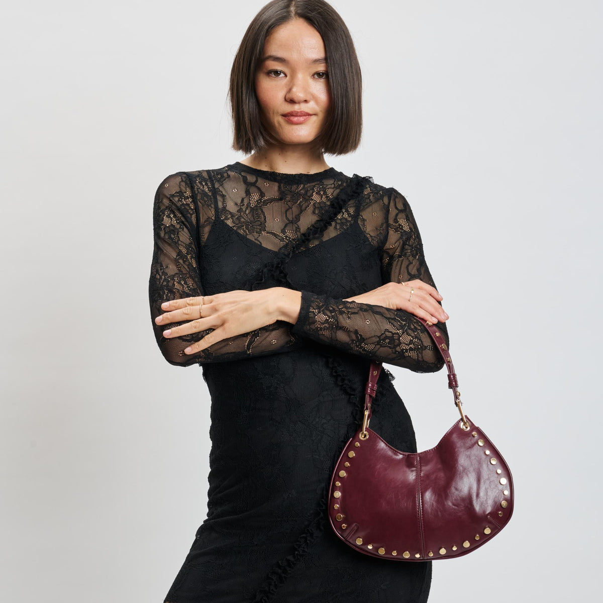 Woman wearing Wine Moda Luxe Nova Crossbody 842017139645 View 1 | Wine