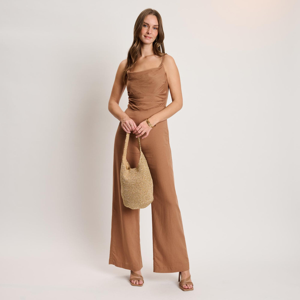 Woman wearing Gold Moda Luxe Starla Tote 842017141143 View 2 | Gold