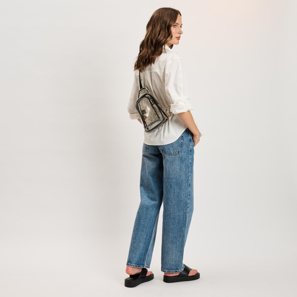 Woman wearing Clear Black Moda Luxe Britney Sling Backpack 842017133513 View 4 | Clear Black