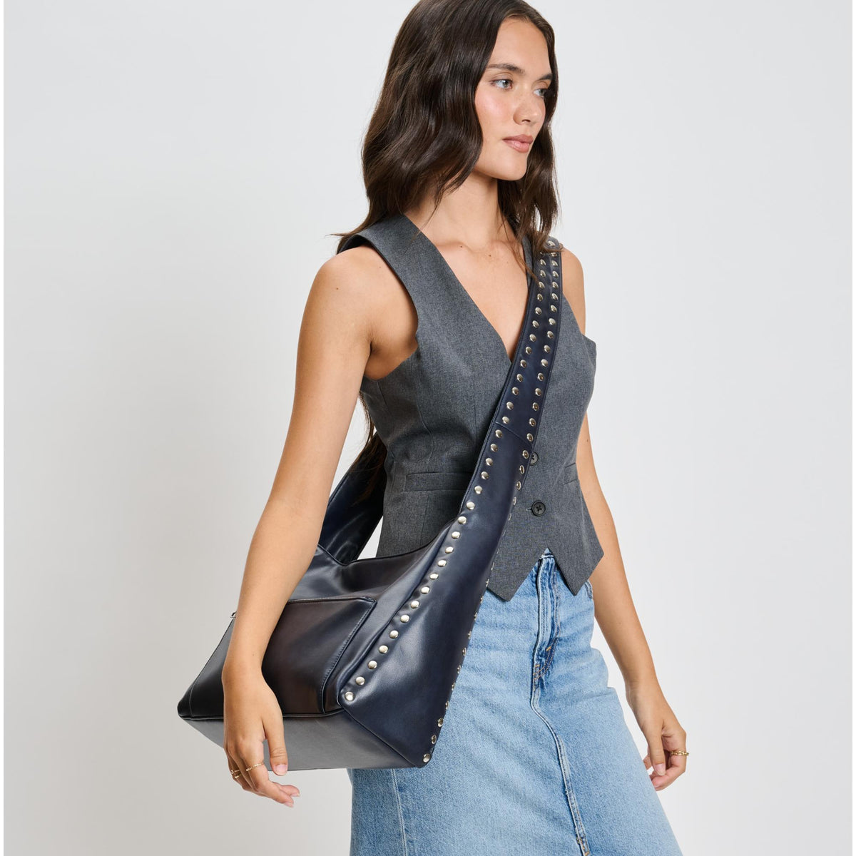Woman wearing Navy Moda Luxe Electra Crossbody 842017136163 View 3 | Navy