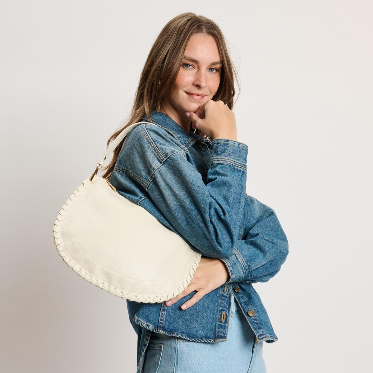 Woman wearing Ivory Moda Luxe Lita Hobo 842017141075 View 3 | Ivory