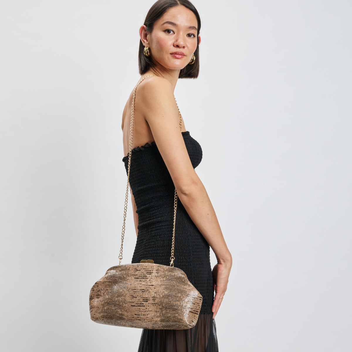 Woman wearing Brown Moda Luxe Camille Clutch 842017139201 View 3 | Brown