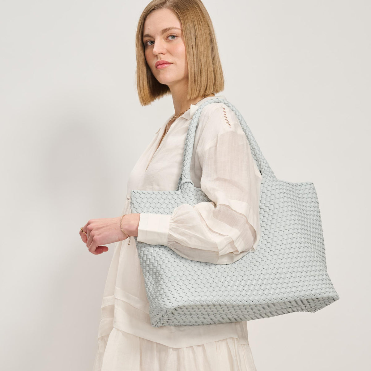Woman wearing Ice Blue Moda Luxe Solana Tote 842017137221 View 3 | Ice Blue