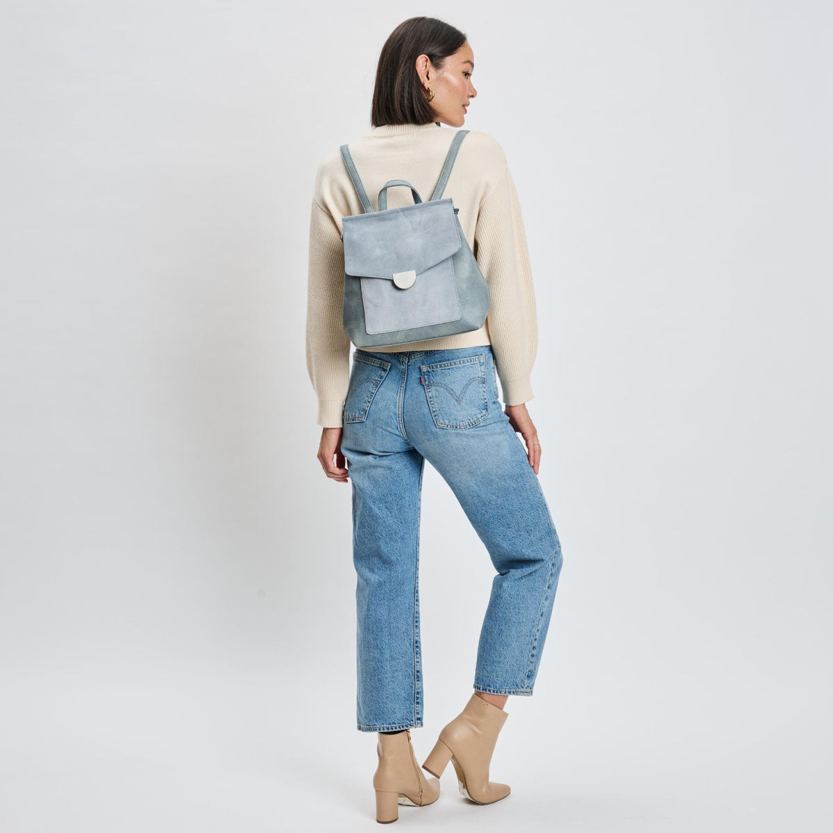 Woman wearing Light Blue Moda Luxe Lynn Backpack 842017139867 View 3 | Light Blue