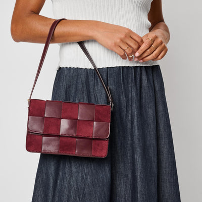 Woman wearing Burgundy Moda Luxe Tanya Crossbody 842017142928 View 1 | Burgundy