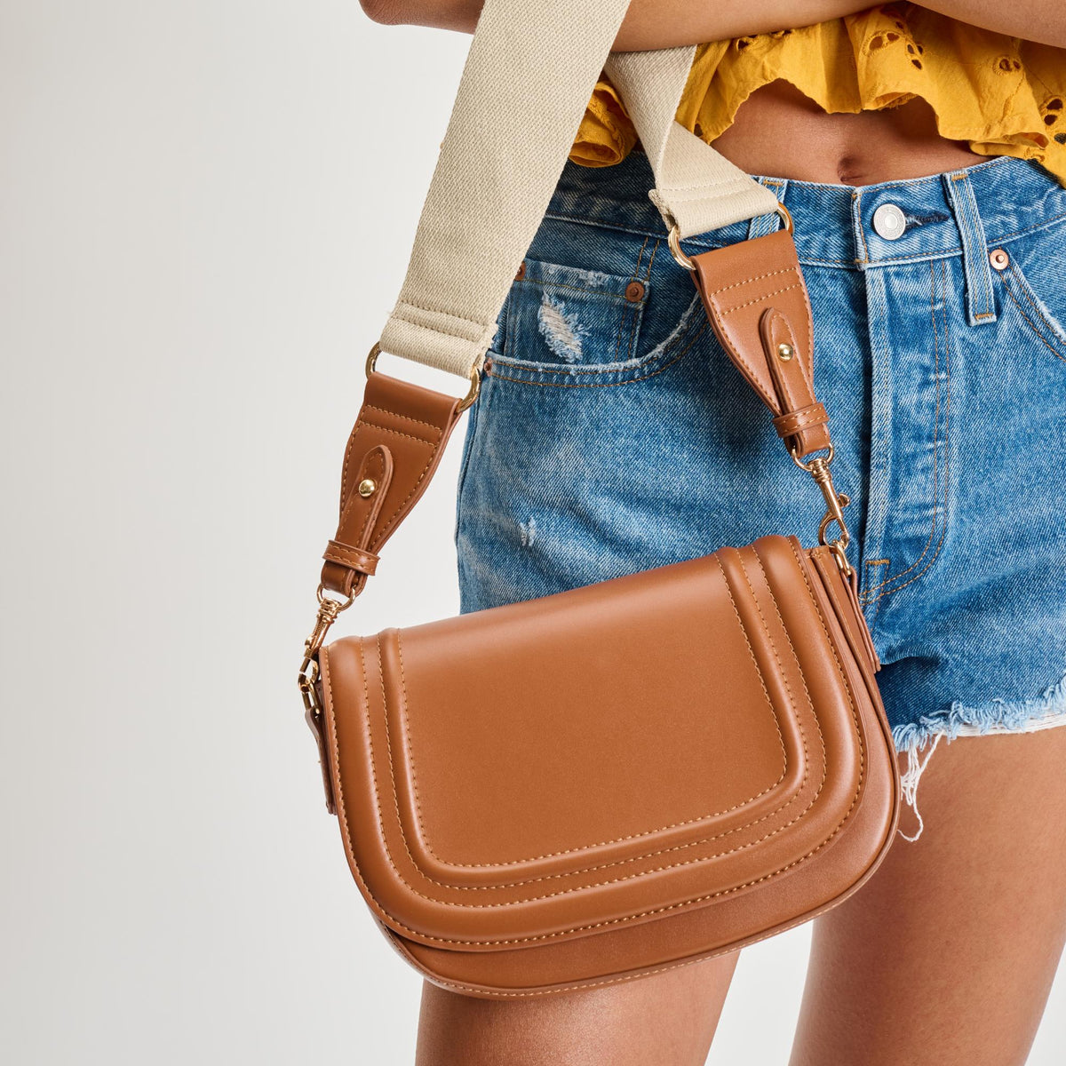 Woman wearing Tan Sol and Selene Poshette Crossbody 842017134749 View 2 | Tan