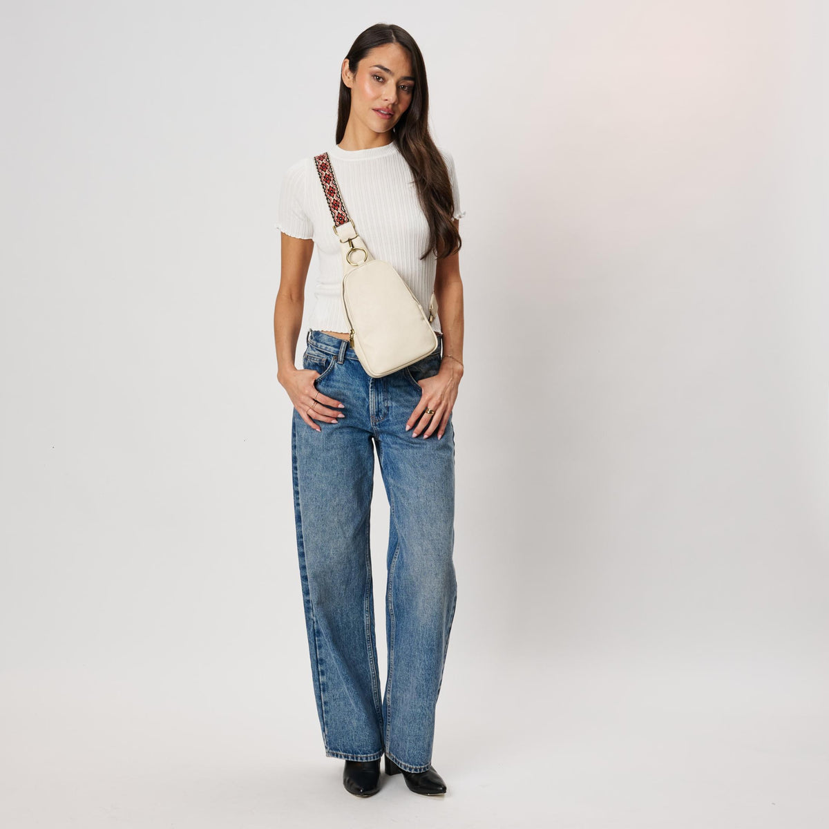 Woman wearing White Moda Luxe Regina Sling Backpack 842017142201 View 4 | White
