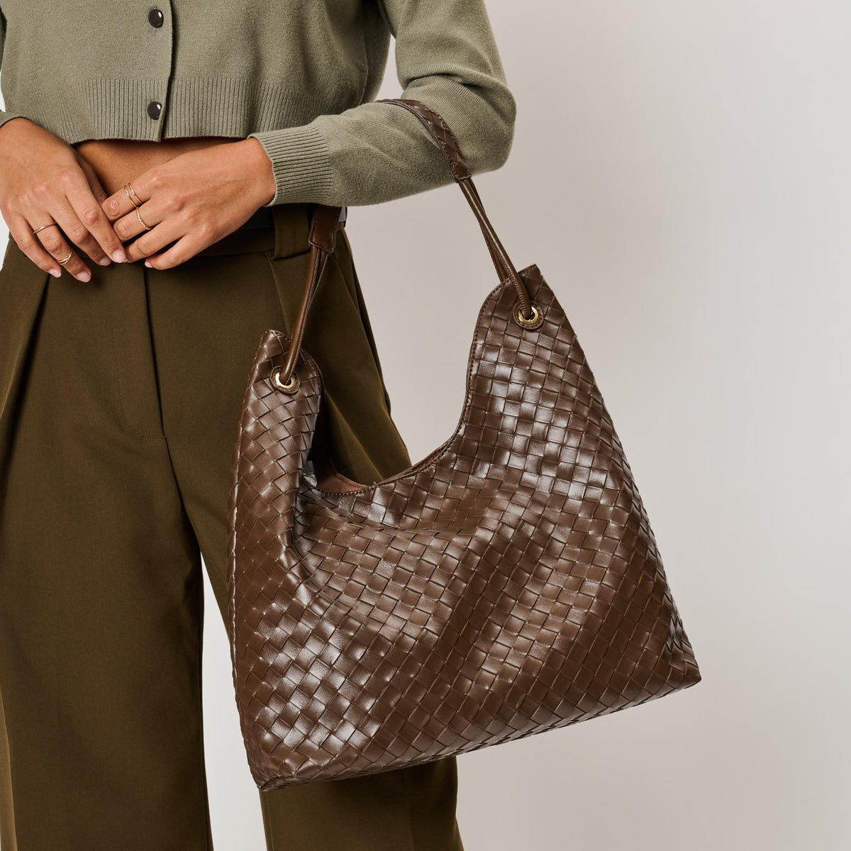 Woman wearing Chocolate Moda Luxe Ezia Hobo 842017142751 View 2 | Chocolate