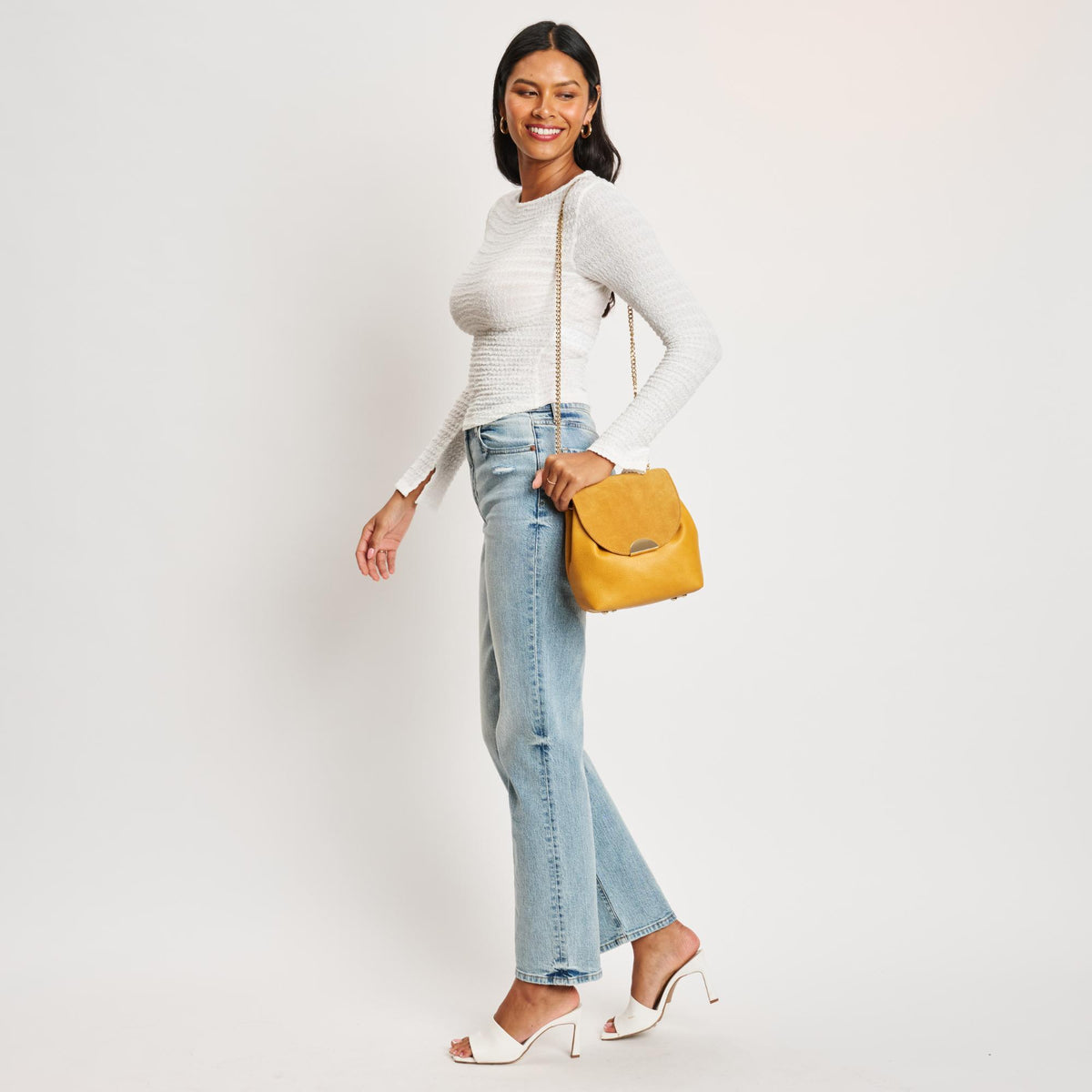 Woman wearing Mustard Moda Luxe Breanna Crossbody 842017127956 View 3 | Mustard