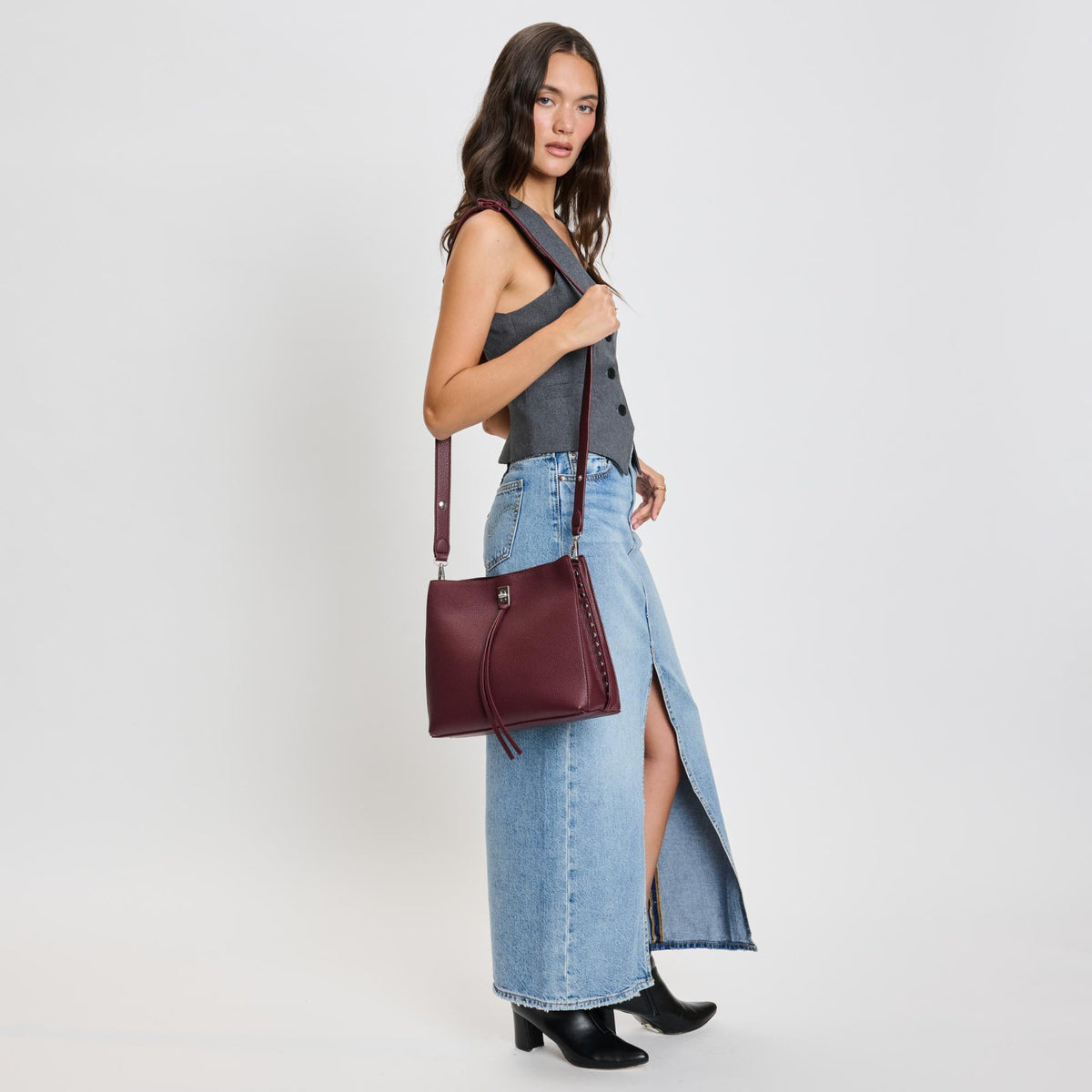 Woman wearing Wine Moda Luxe Eliza Crossbody 842017136040 View 3 | Wine