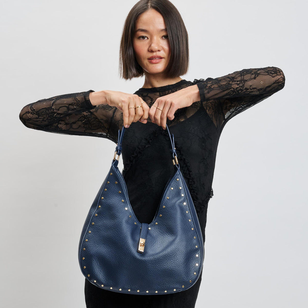 Woman wearing Midnight Sol and Selene Oliva Hobo 842017139386 View 1 | Midnight