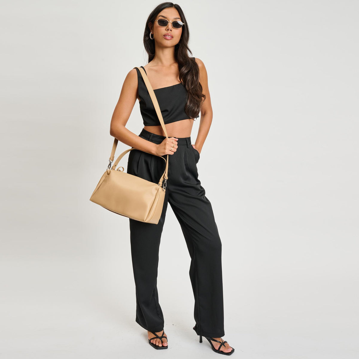 Woman wearing Camel Sol and Selene Trendora Crossbody 842017134619 View 3 | Camel