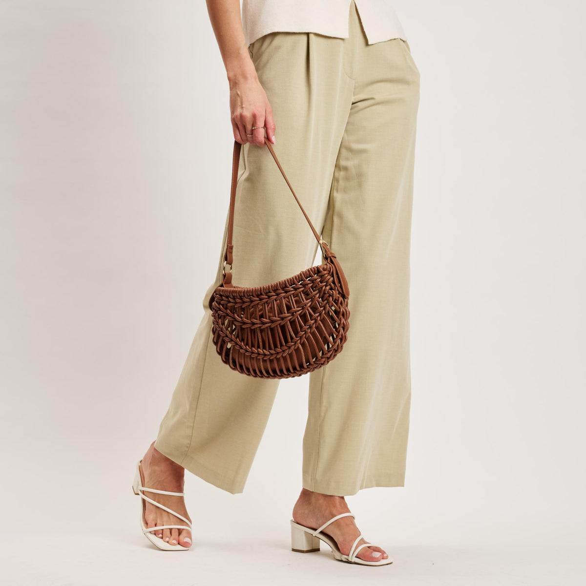 Woman wearing Cognac Moda Luxe Francesca Clutch 842017141396 View 3 | Cognac