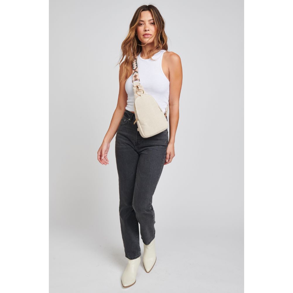Woman wearing Oatmeal Moda Luxe Regina Canvas Sling Backpack 842017131007 View 3 | Oatmeal
