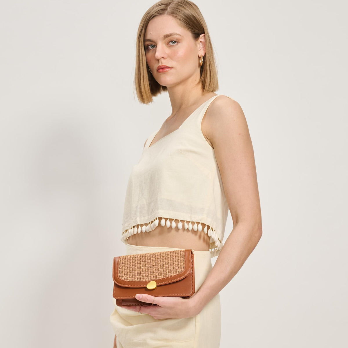 Woman wearing Tan Moda Luxe Nina Crossbody 842017137160 View 3 | Tan