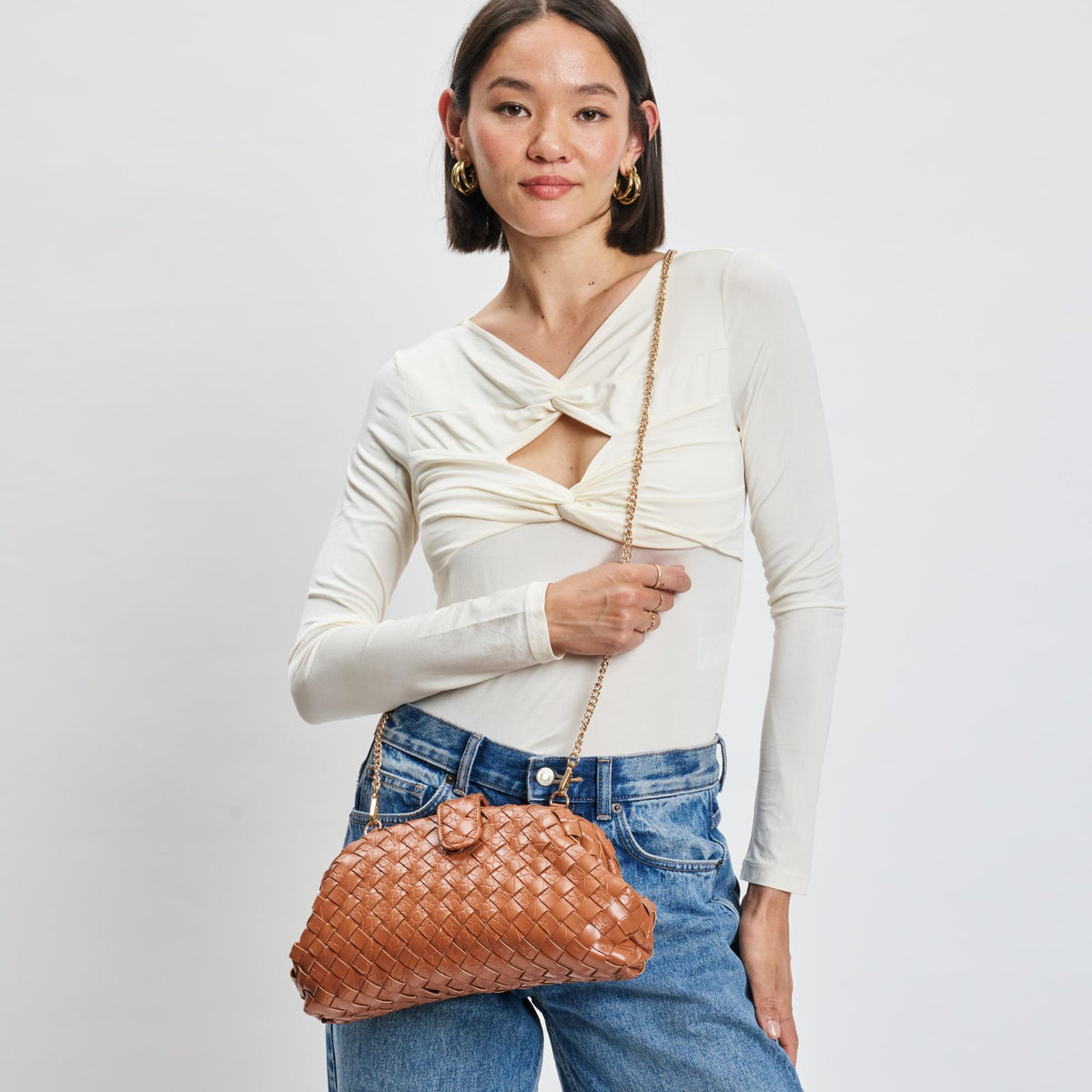 Woman wearing Tan Sol and Selene GiGi Crossbody 842017139614 View 1 | Tan