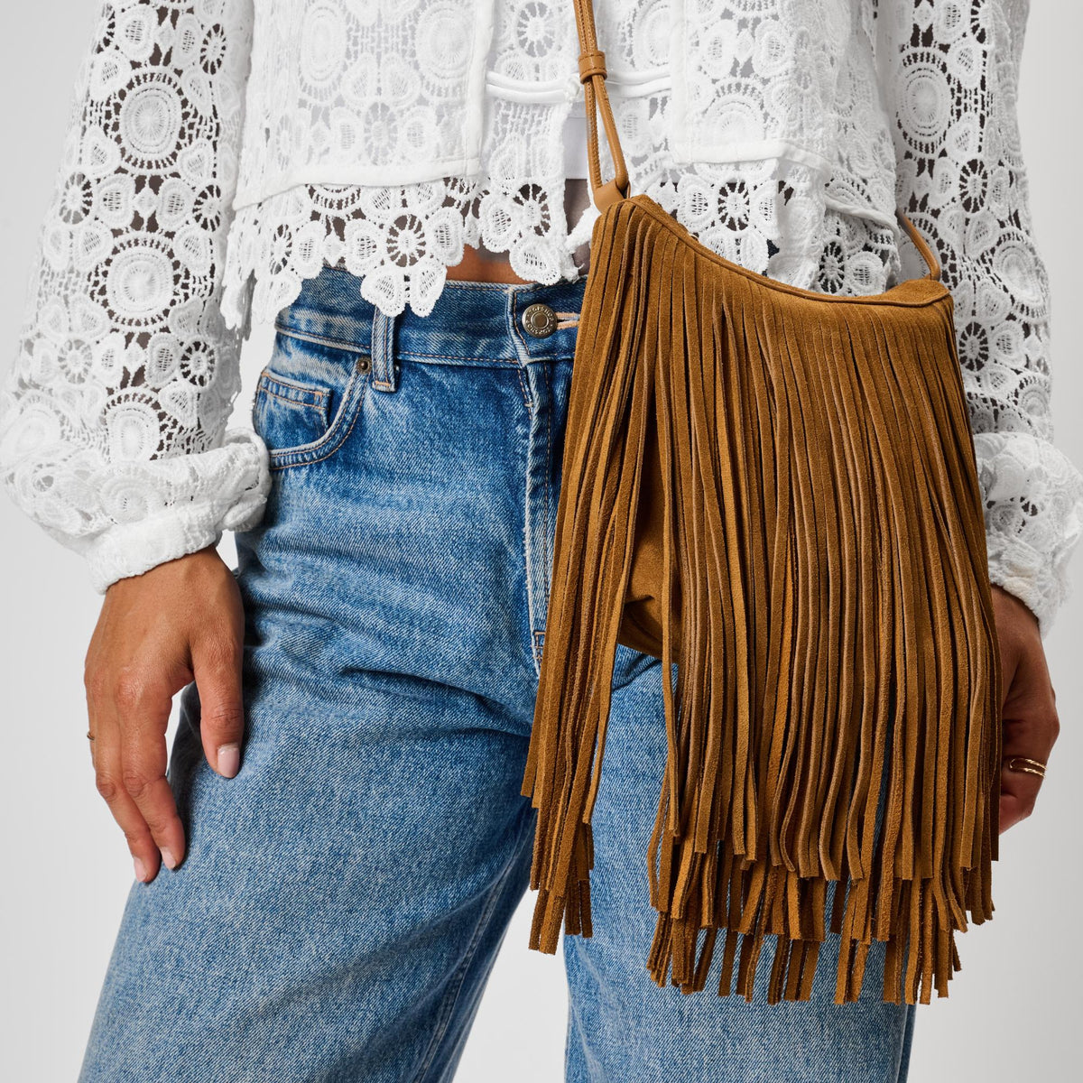 Woman wearing Caramel Moda Luxe Arizona Crossbody 842017142324 View 2 | Caramel