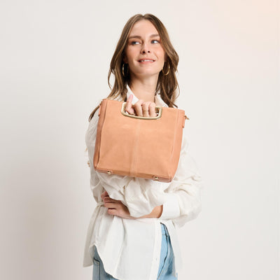 Woman wearing Salmon Moda Luxe Brielle Crossbody 842017141501 View 1 | Salmon