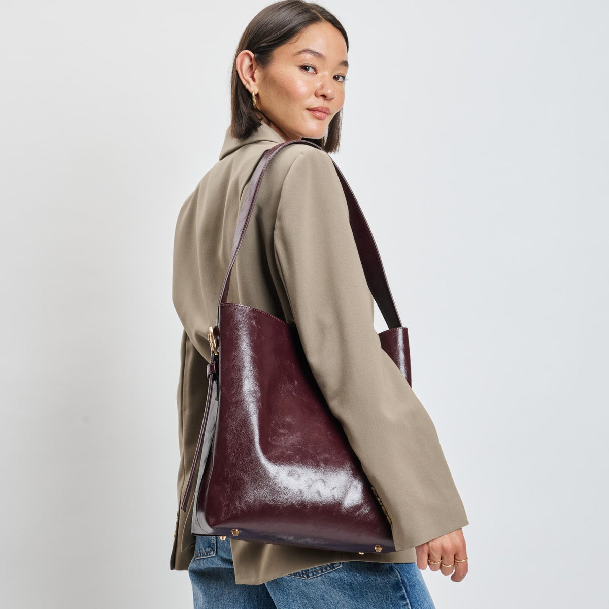 Woman wearing Burgundy Moda Luxe Brooke Bucket 842017139522 View 1 | Burgundy