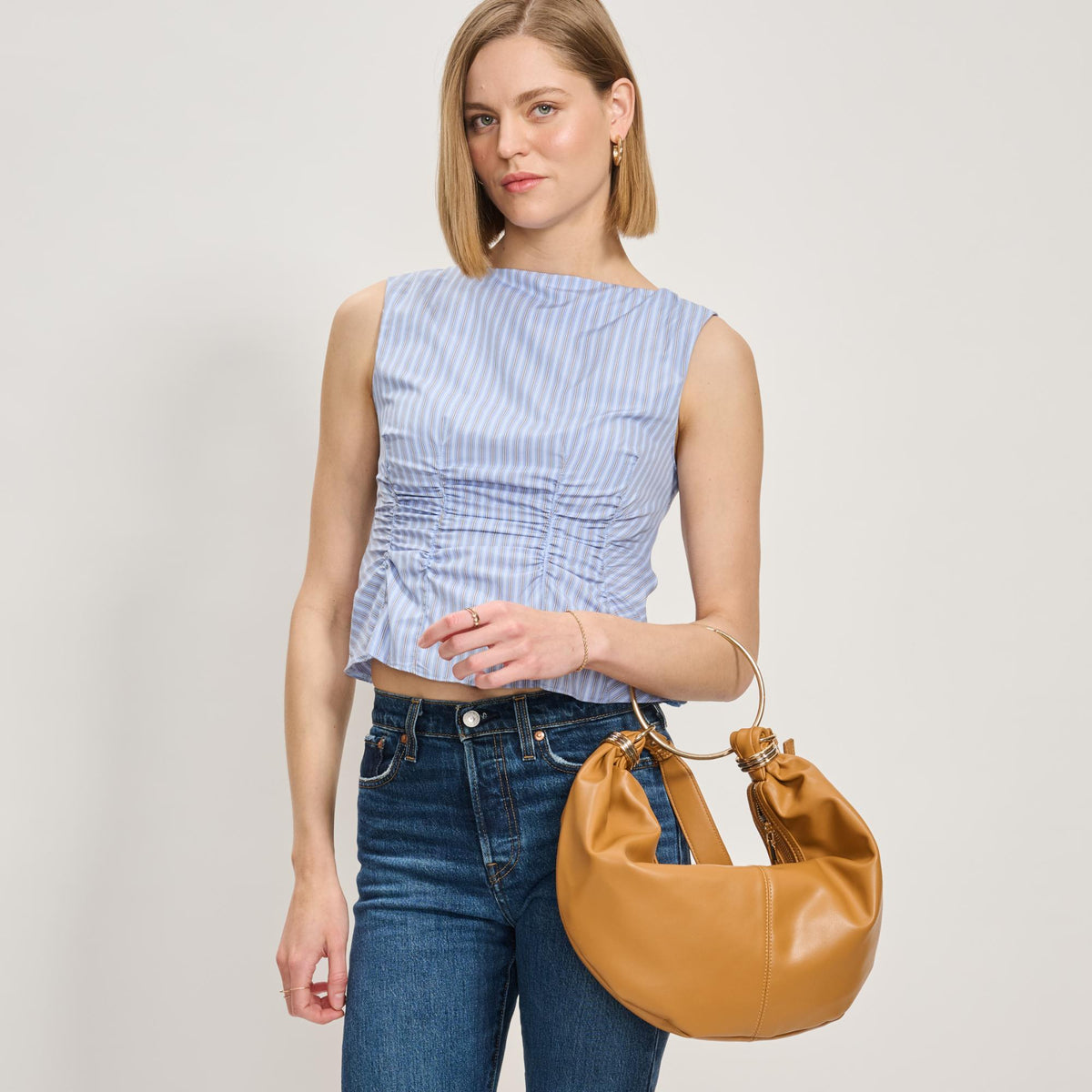 Woman wearing Tan Moda Luxe Azura Crossbody 842017138006 View 2 | Tan
