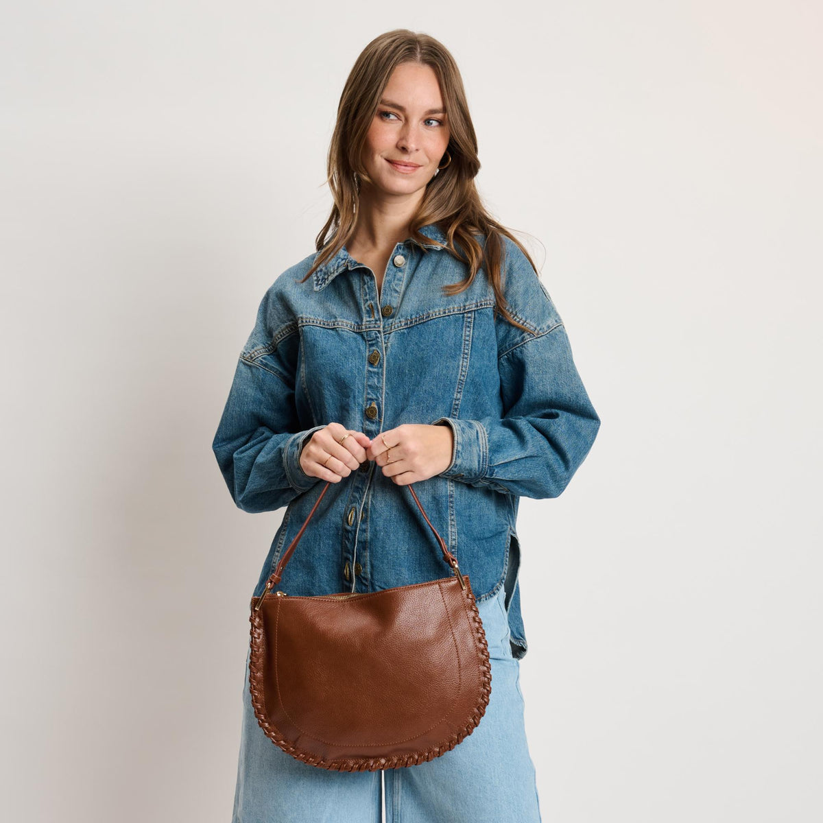 Woman wearing Chocolate Moda Luxe Lita Hobo 842017141082 View 3 | Chocolate