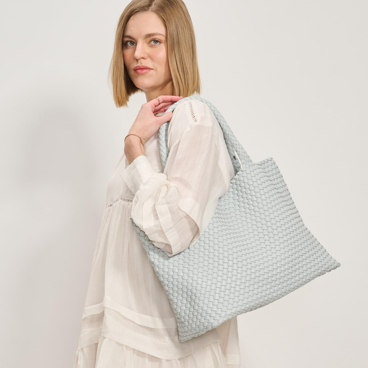 Woman wearing Ice Blue Moda Luxe Solana Tote 842017137221 View 2 | Ice Blue