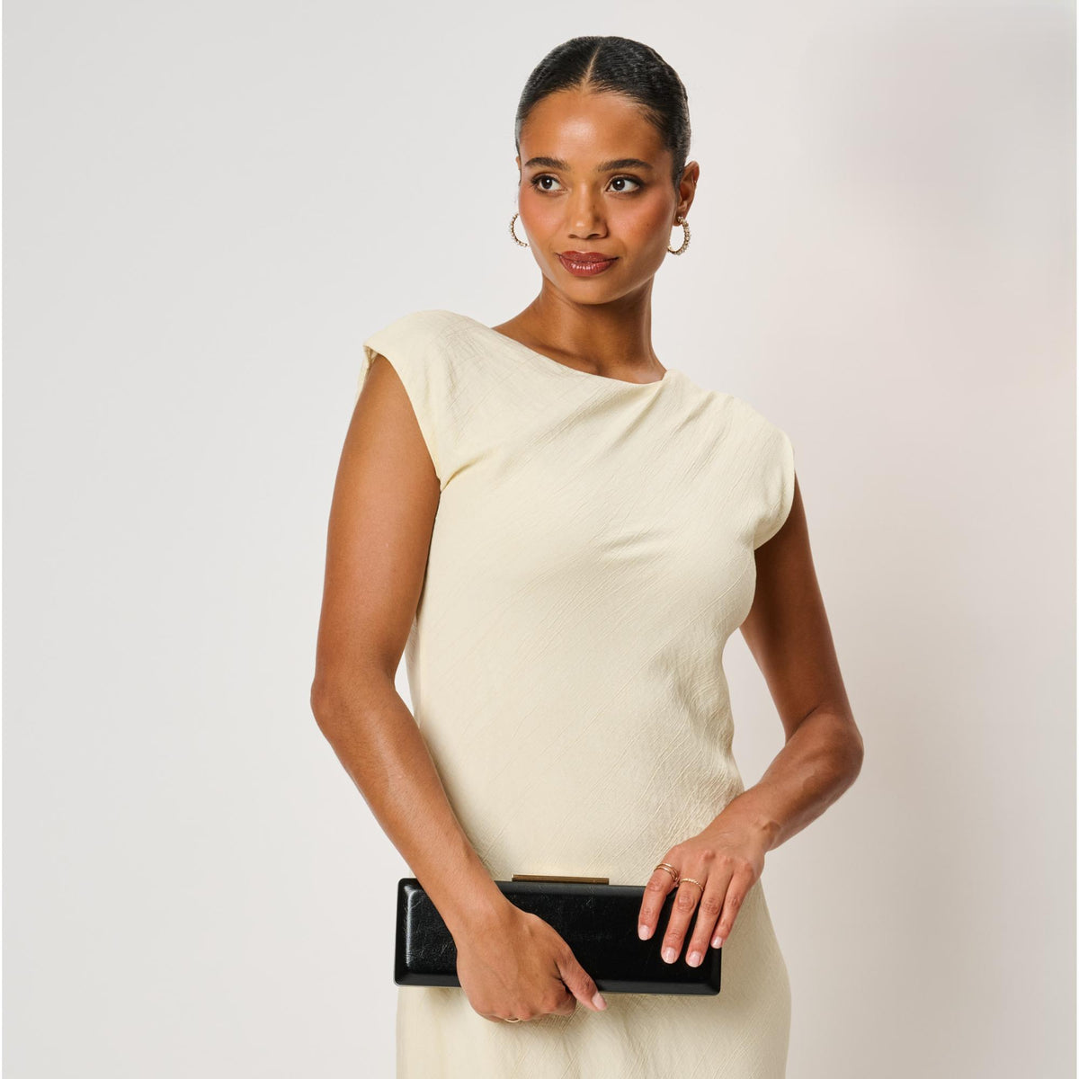 Woman wearing Black Moda Luxe Angie Clutch 842017142478 View 2 | Black