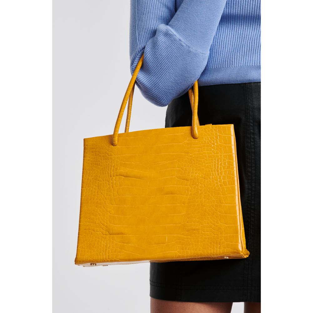 Woman wearing Mustard Moda Luxe Pierce Mini Tote 842017125853 View 2 | Mustard