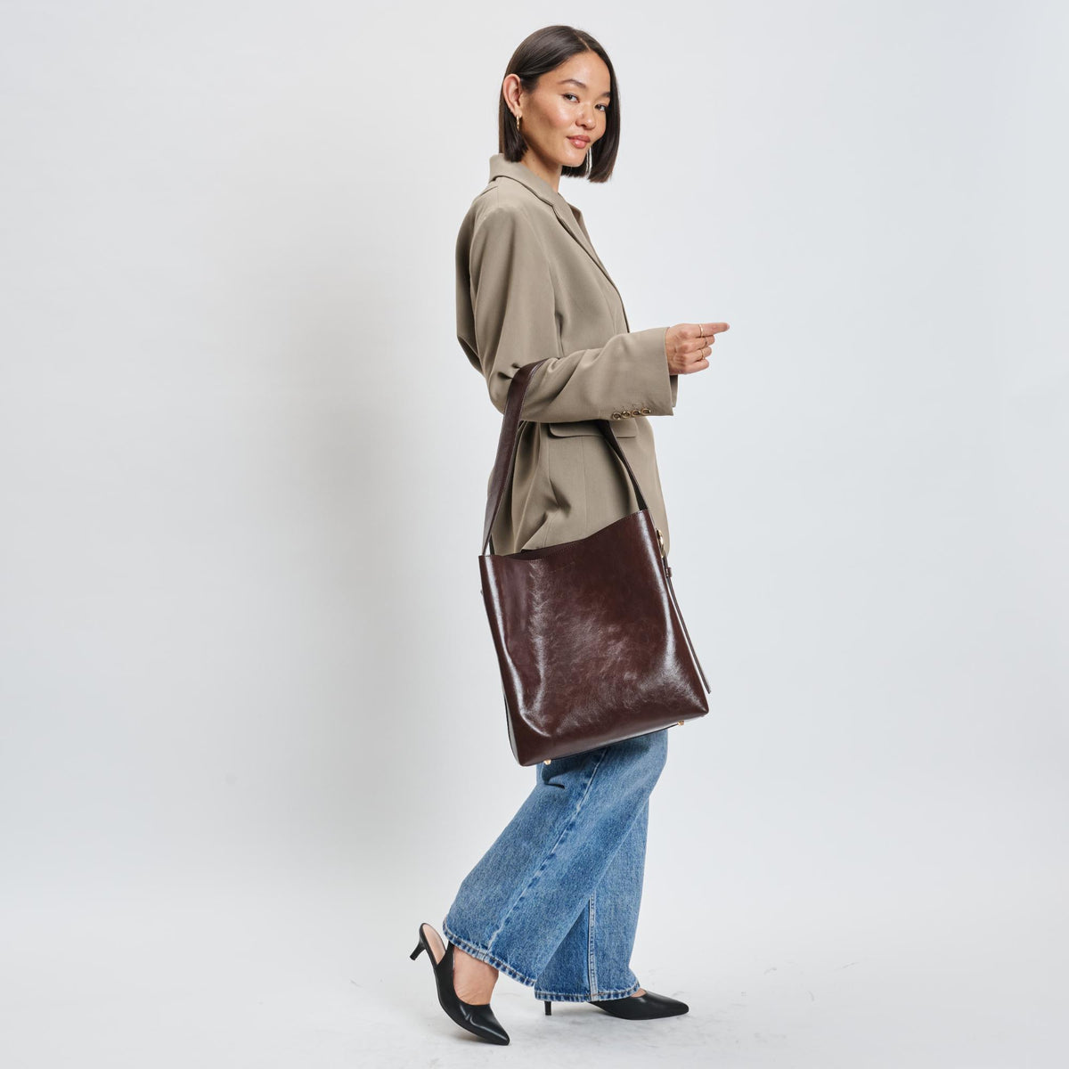 Woman wearing Chocolate Sol and Selene Brooke Bucket 842017139546 View 3 | Chocolate