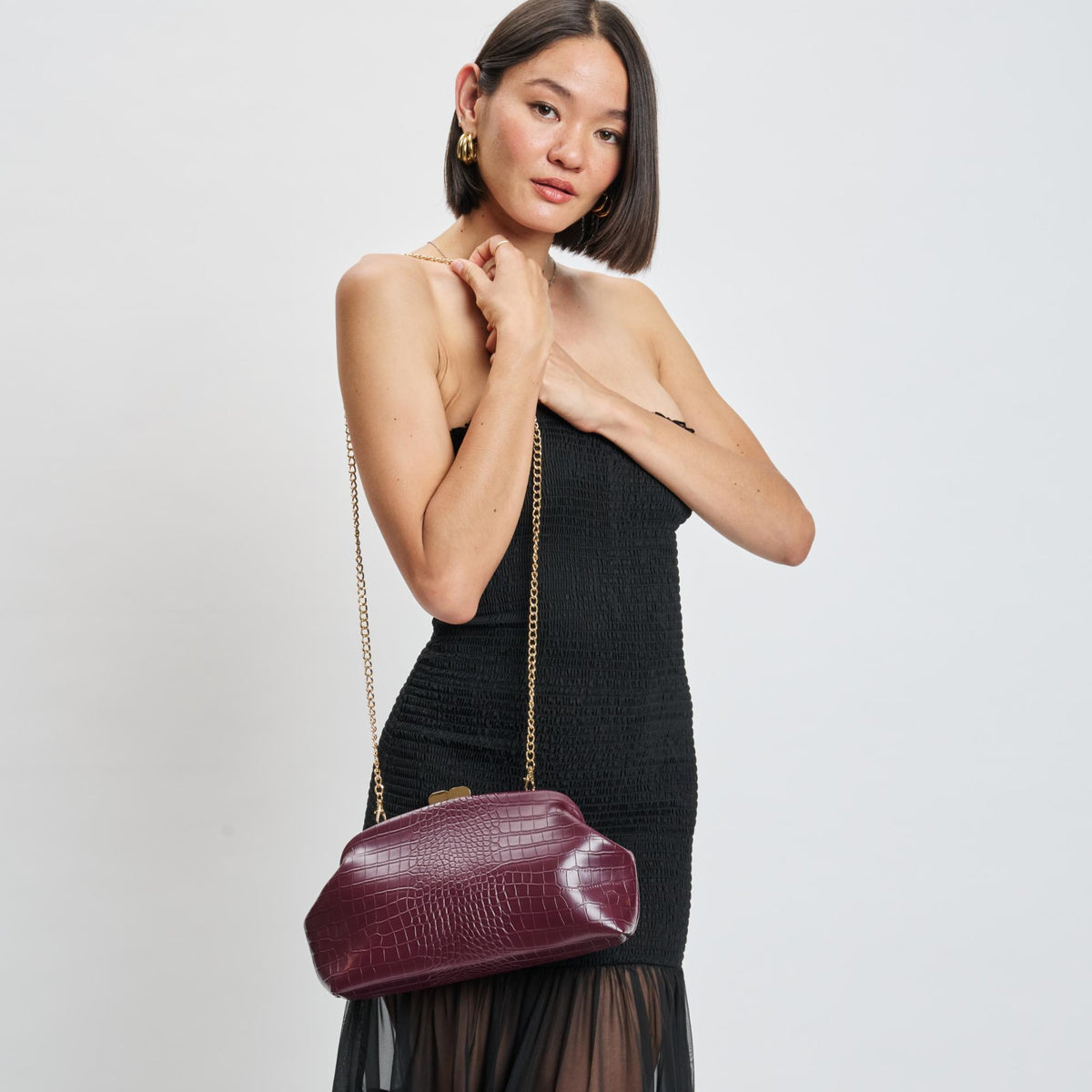 Woman wearing Burgundy Moda Luxe Camille Clutch 842017139188 View 1 | Burgundy
