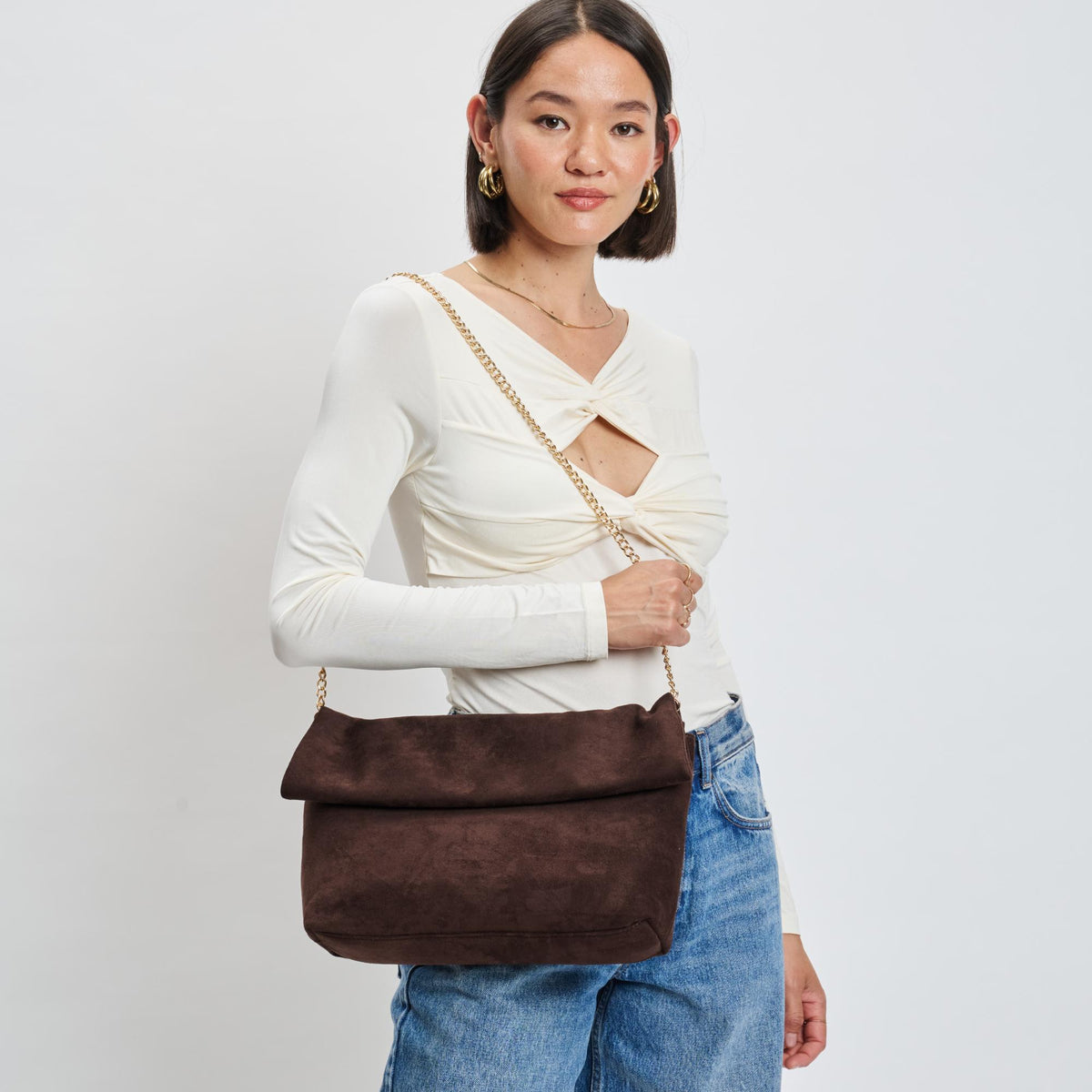 Woman wearing Chocolate Moda Luxe Zarae Crossbody 842017139997 View 1 | Chocolate