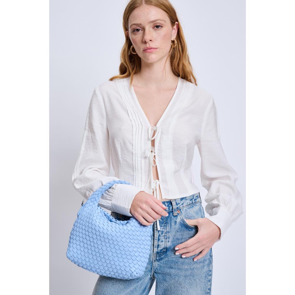 Woman wearing Sky Blue Moda Luxe Jessamine Crossbody 842017132950 View 1 | Sky Blue