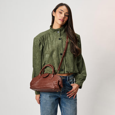 Woman wearing Chocolate Moda Luxe Brookhaven Satchel 842017142782 View 1 | Chocolate