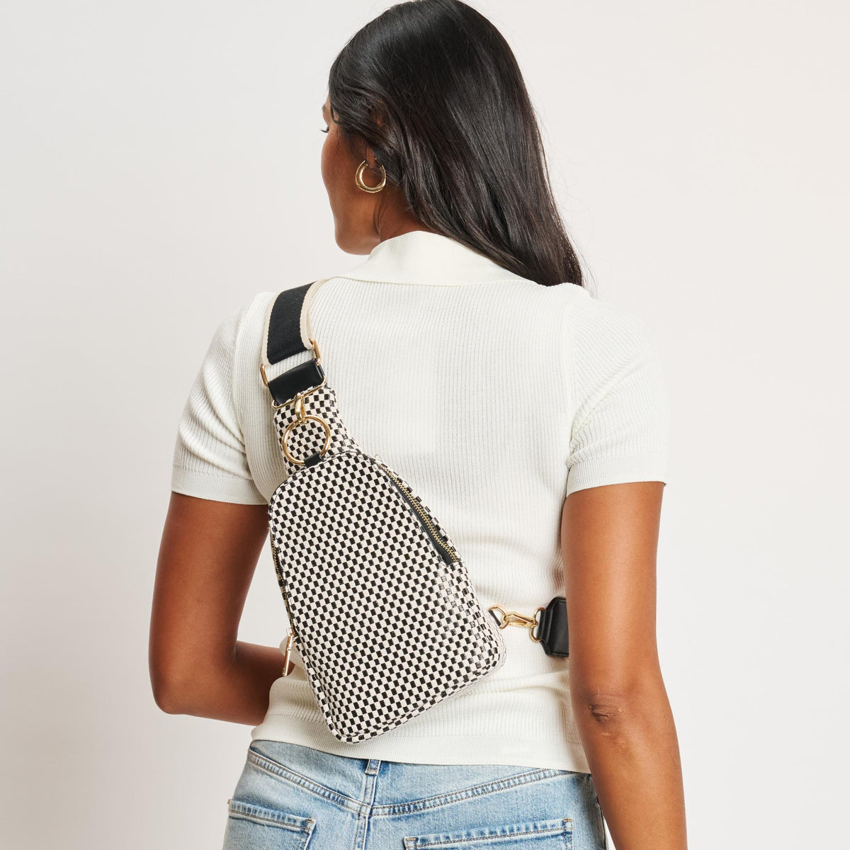 Woman wearing Black White Moda Luxe Regina - Checkered Sling Backpack 842017136194 View 2 | Black White
