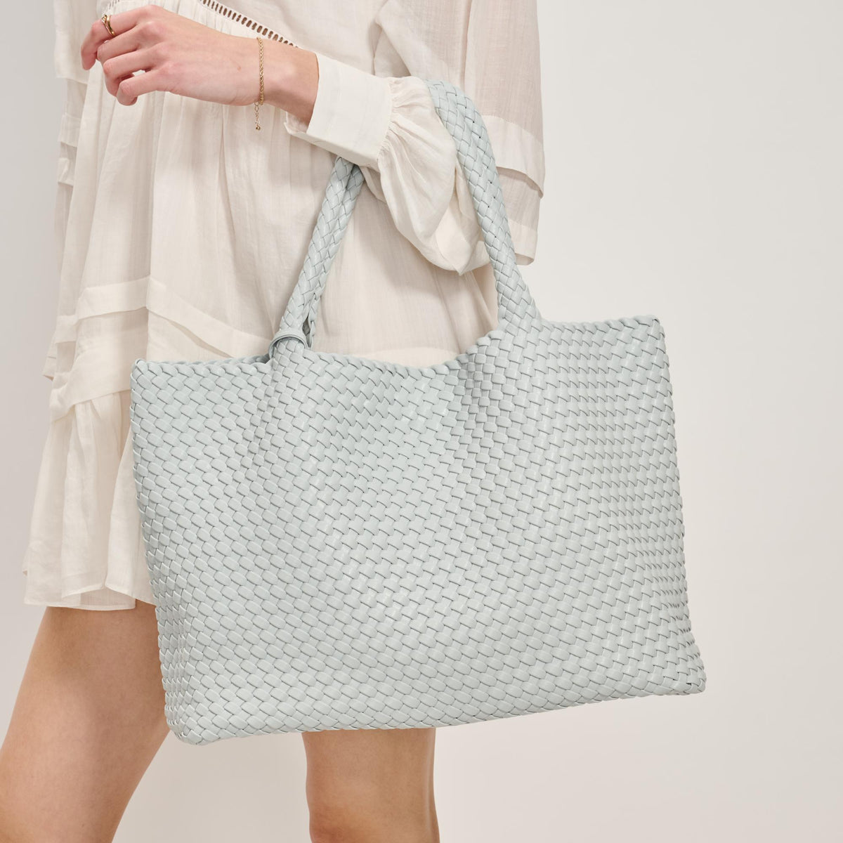 Woman wearing Ice Blue Moda Luxe Solana Tote 842017137221 View 1 | Ice Blue